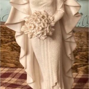 Elegant Cream Figurine with Ruffled Dress